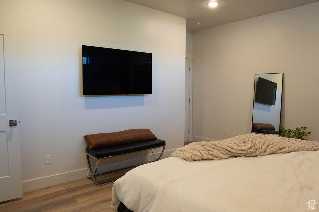 Bedroom with light wood-style flooring and recessed lighting