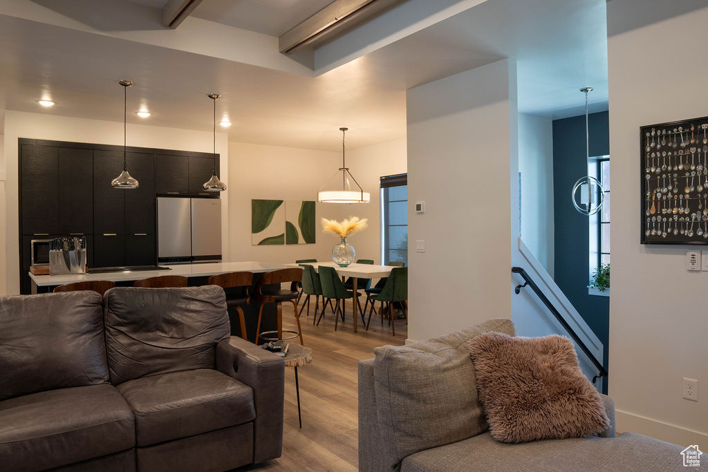 Living room featuring light wood-style flooring and recessed lighting