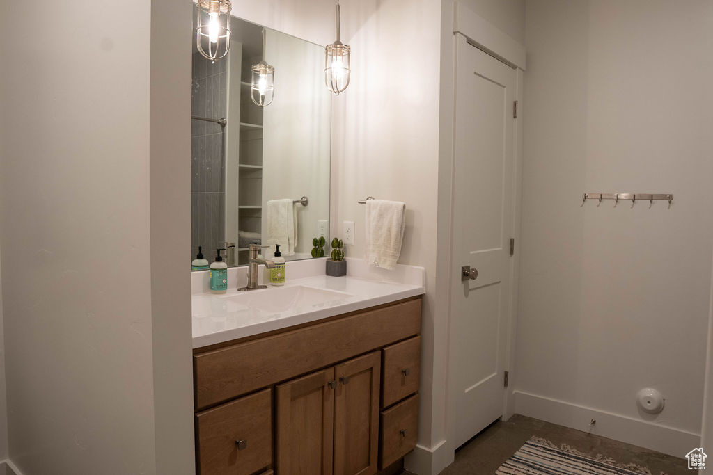Bathroom featuring vanity and baseboards