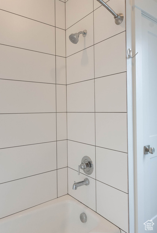 Full bath featuring tub / shower combination