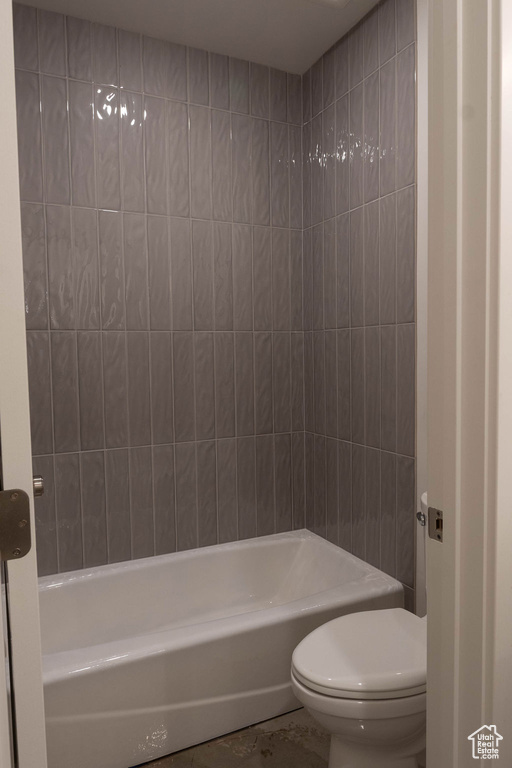 Bathroom with toilet and bathing tub / shower combination