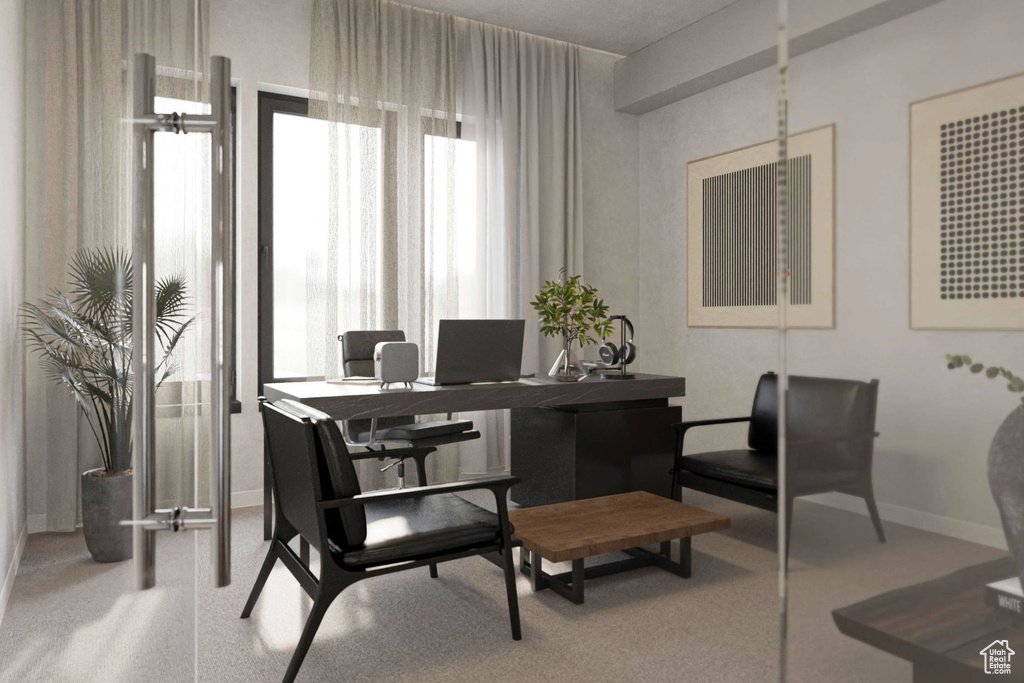 Carpeted office space with baseboards