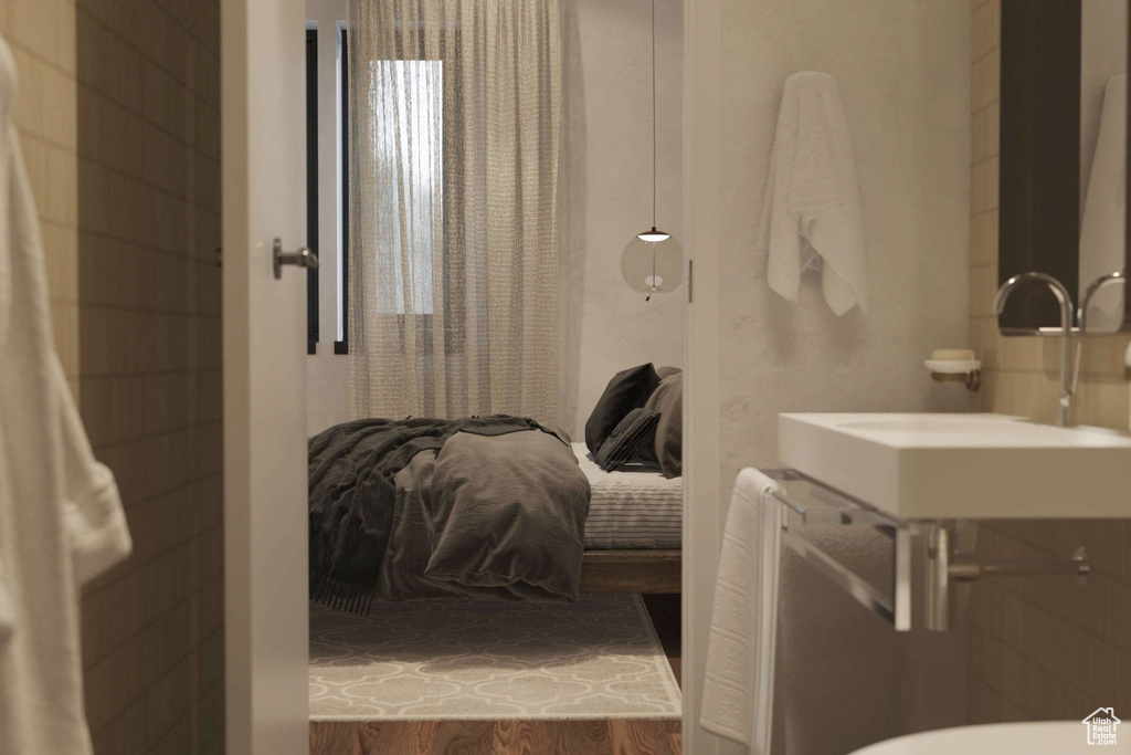 Bathroom with a sink and wood finished floors