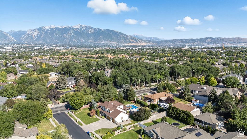 Aerial view of residential area featuring a mountain backdrop