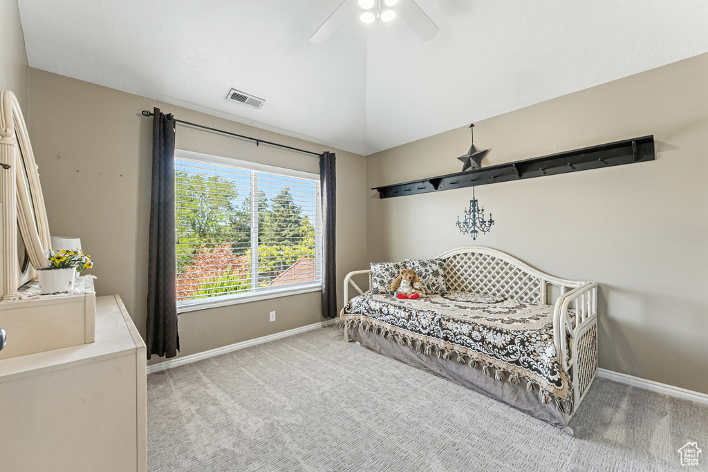 Bedroom featuring light colored carpet and ceiling fan