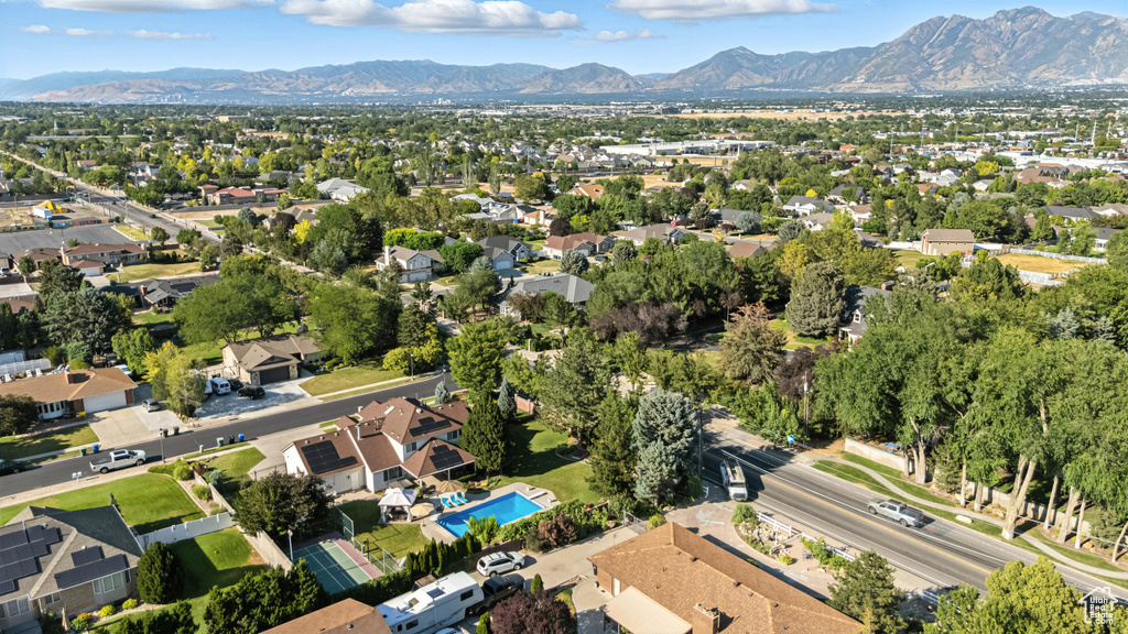 Aerial perspective of suburban area with a mountainous background