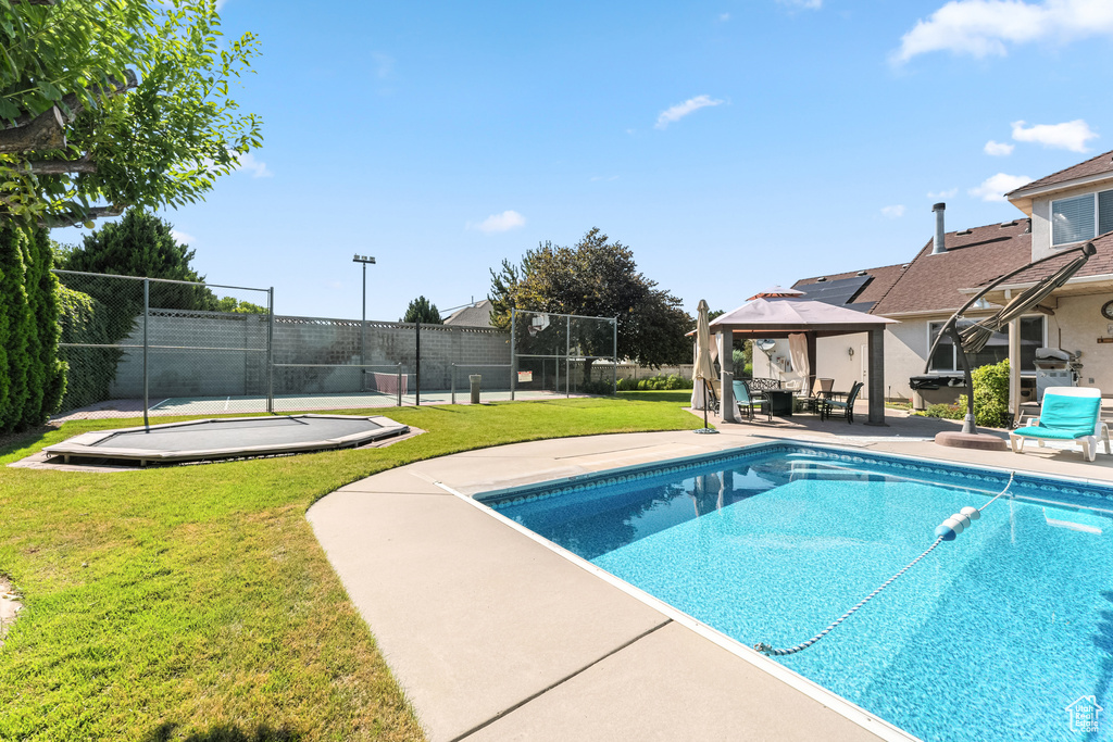 View of pool featuring a gazebo and a patio