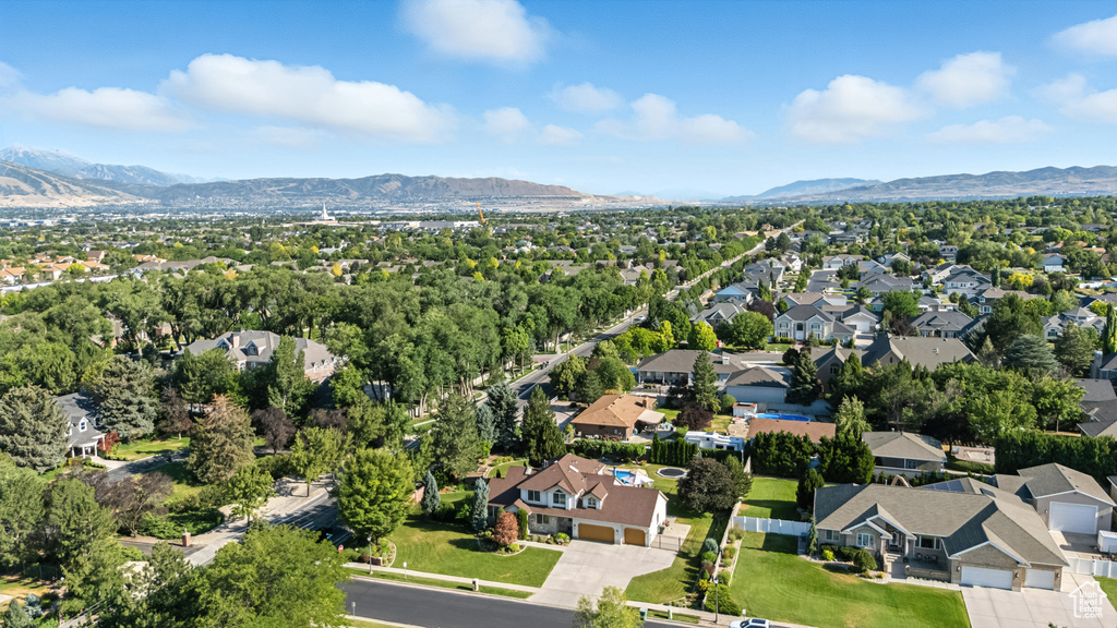 Aerial perspective of suburban area with a mountain backdrop