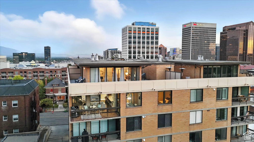 View of building exterior featuring a city view