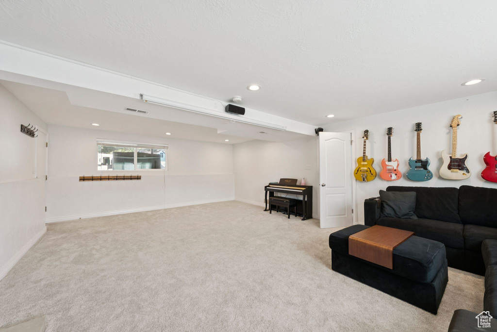 Living area featuring carpet and recessed lighting