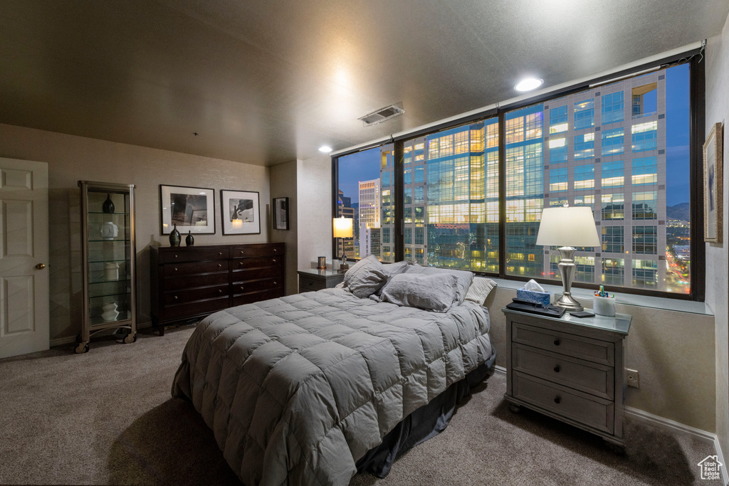 Carpeted bedroom featuring baseboards and recessed lighting