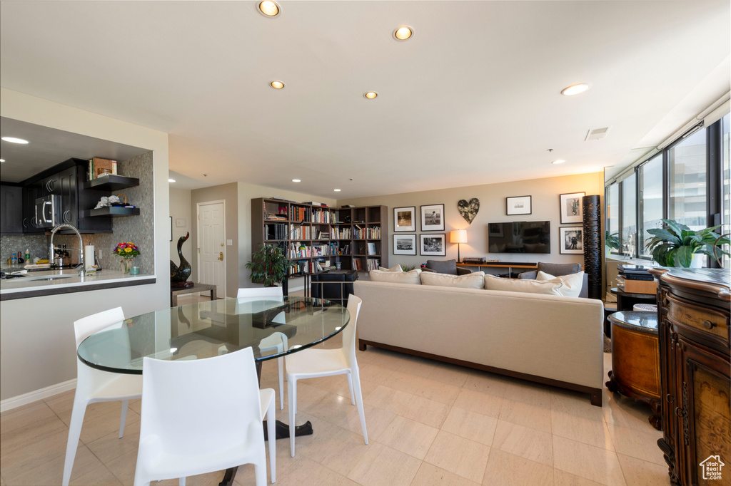 Dining space featuring recessed lighting and baseboards