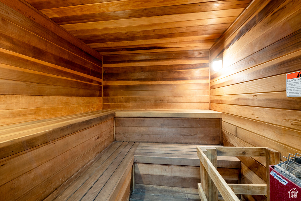 Relaxing sauna / steam room with wooden ceiling and wood walls