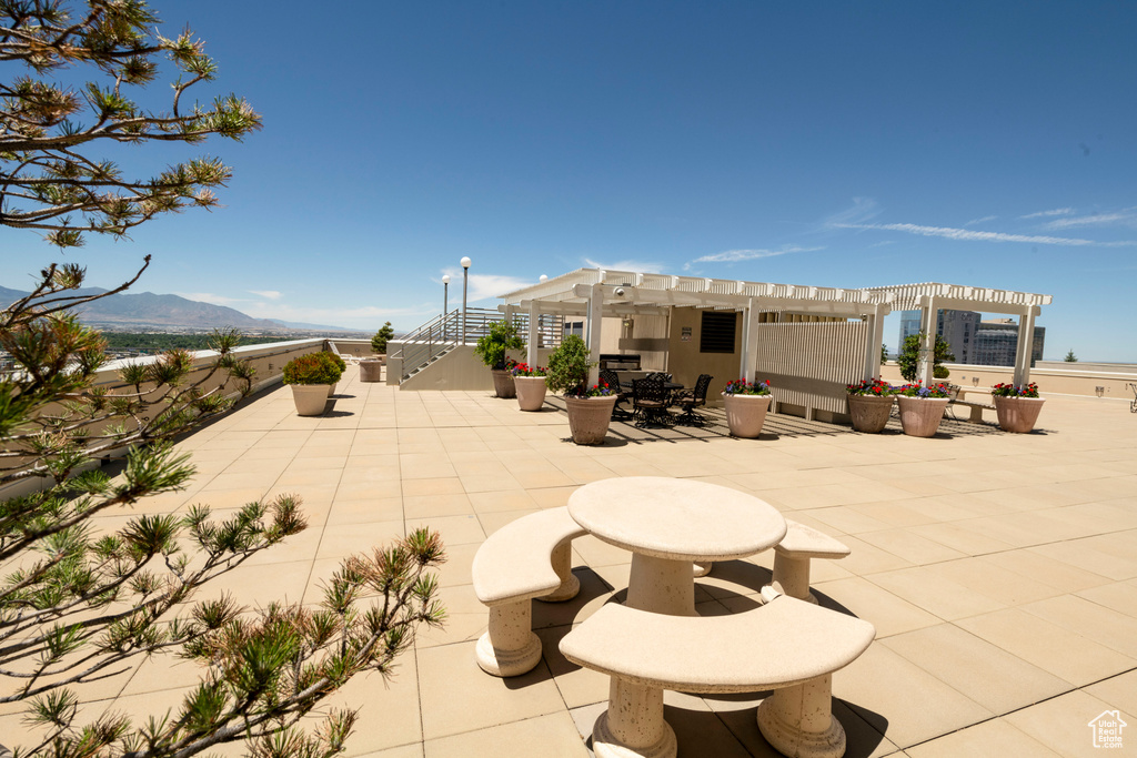View of patio / terrace featuring a pergola and a mountain view