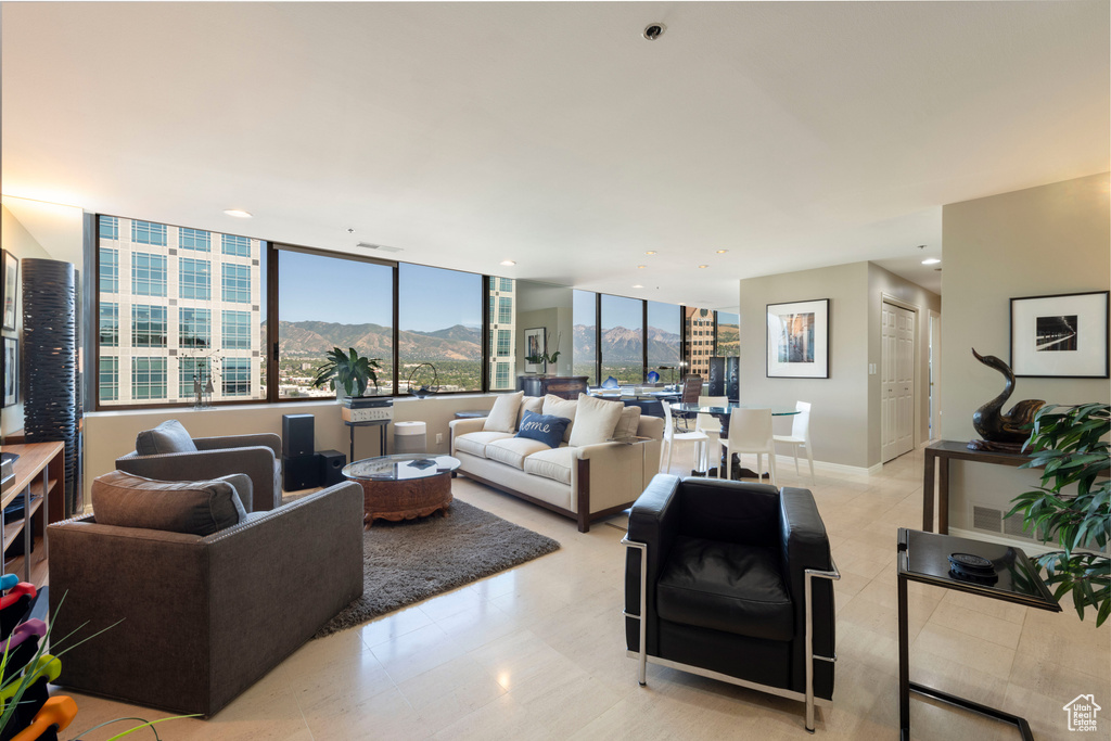 Living area with a mountain view and recessed lighting