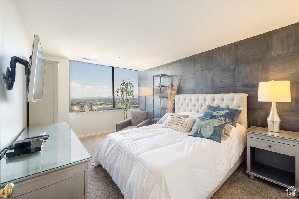 Carpeted bedroom featuring baseboards