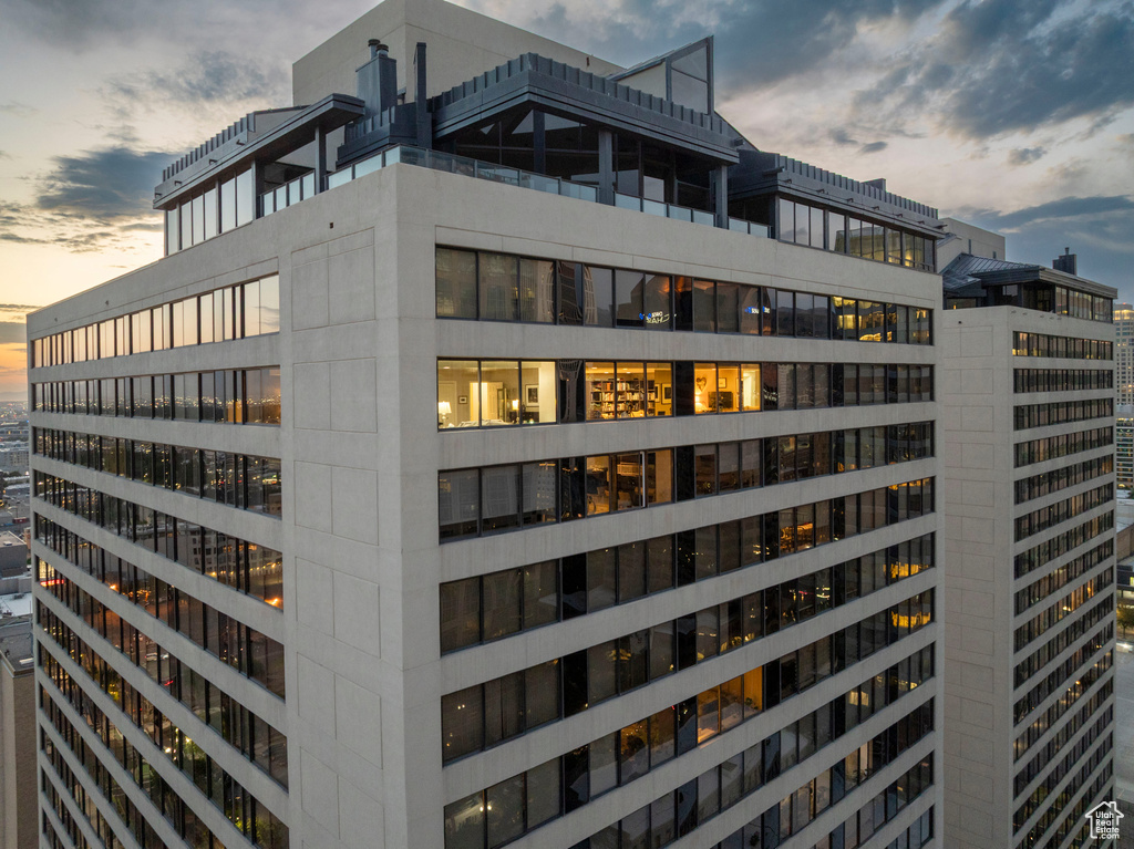 View of property at dusk