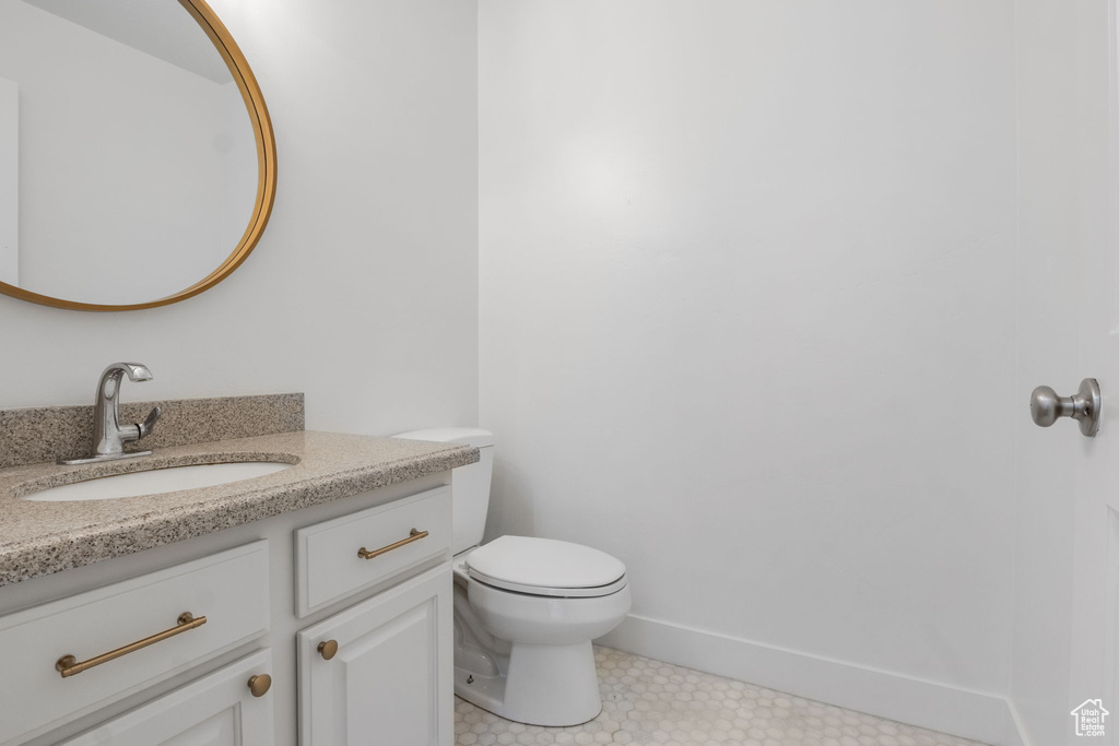 Bathroom featuring vanity and toilet