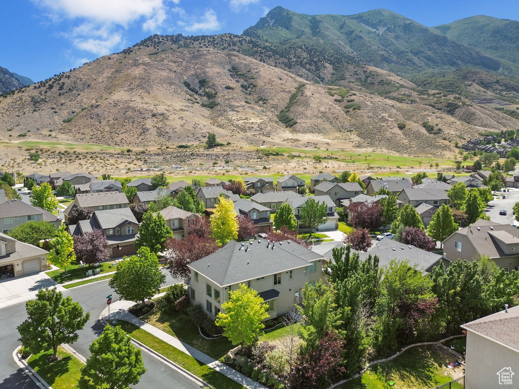 Aerial view of residential area with a mountainous background