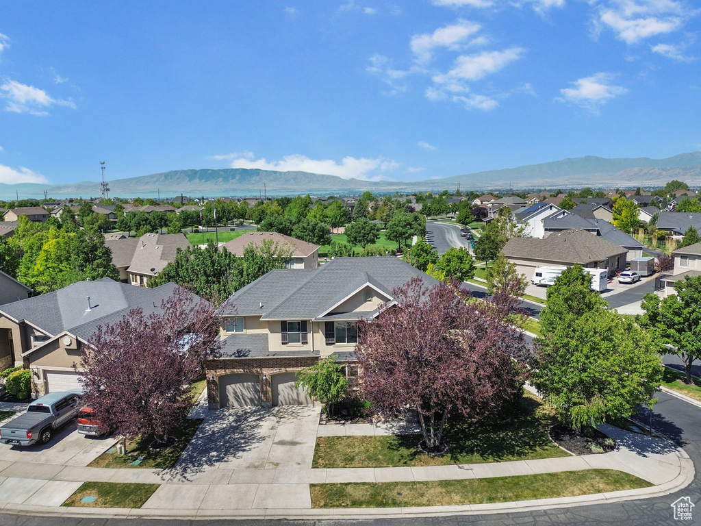 Aerial perspective of suburban area with a mountainous background