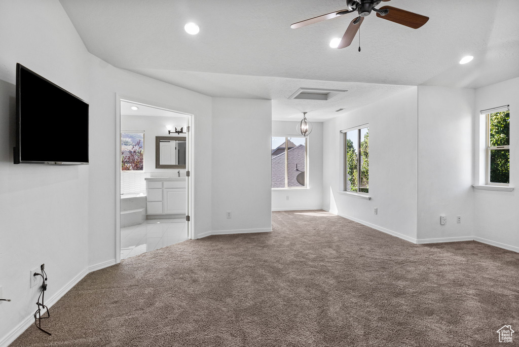 Unfurnished living room with carpet flooring, ceiling fan, and recessed lighting