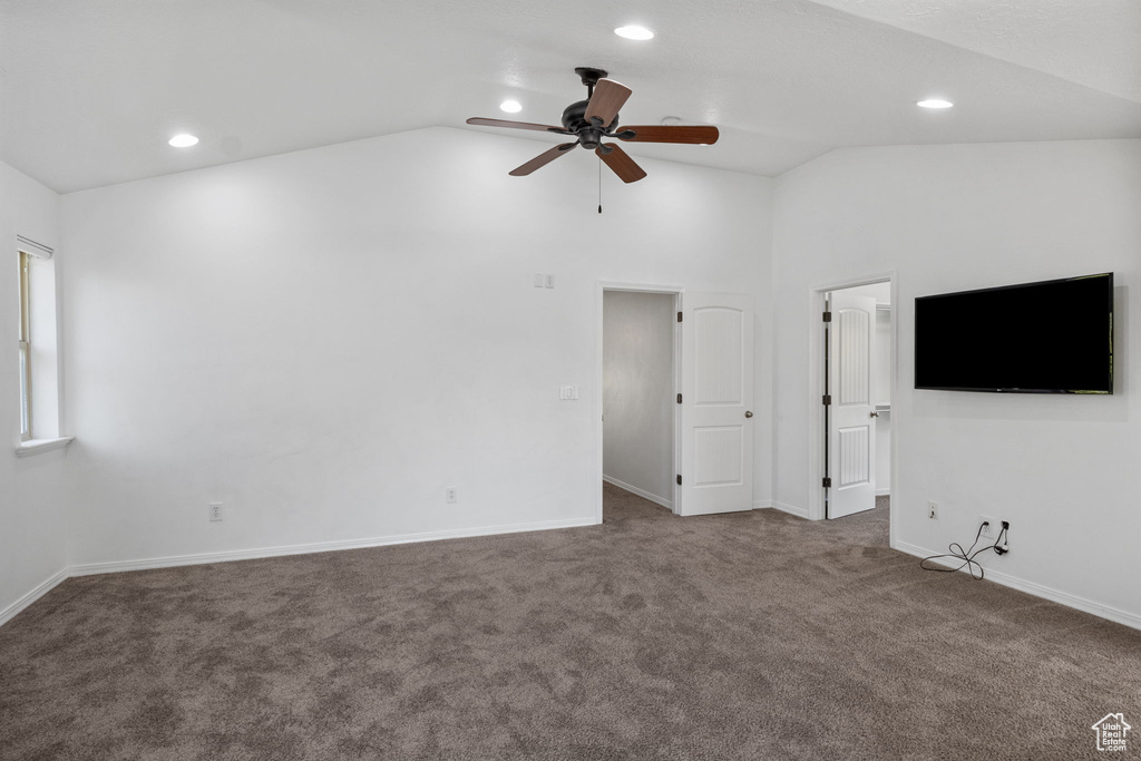 Unfurnished living room with vaulted ceiling, carpet flooring, a ceiling fan, and recessed lighting