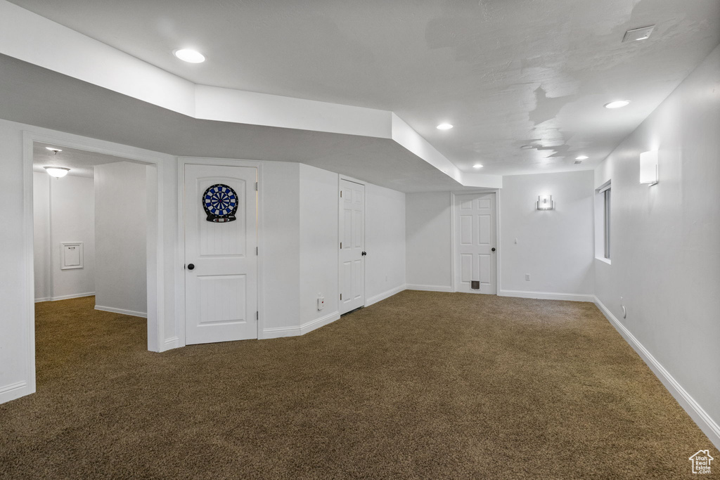 Finished below grade area featuring carpet floors and recessed lighting