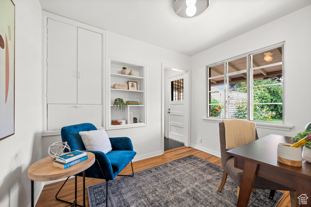Office area with wood finished floors and baseboards