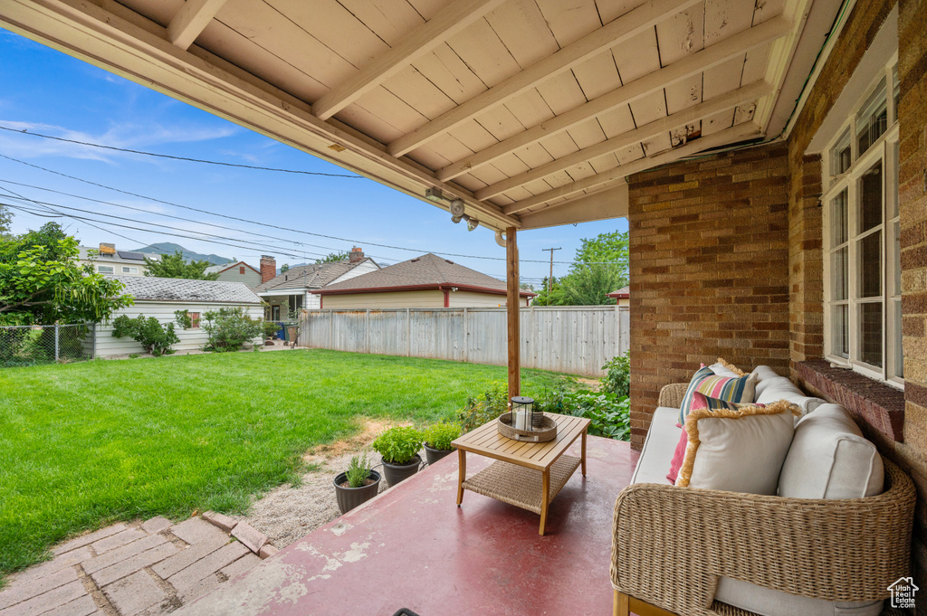 Fenced backyard featuring a patio and outdoor lounge area