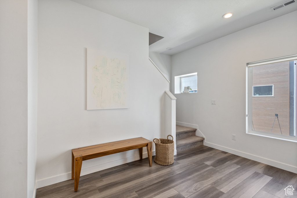 Foyer featuring stairway, wood finished floors, and recessed lighting