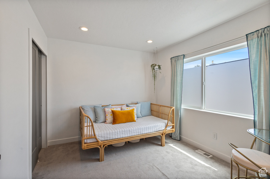 Sitting room with carpet flooring and recessed lighting