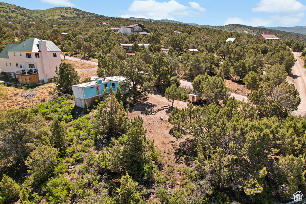 Aerial view of property and surrounding area with mountains