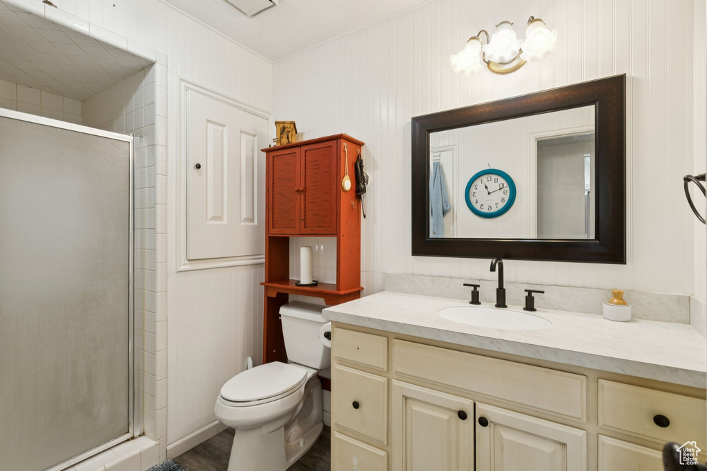 Full bathroom with vanity and a shower stall