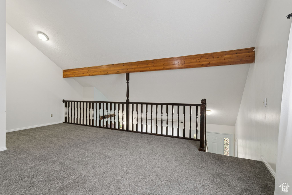Additional living space featuring carpet floors and baseboards