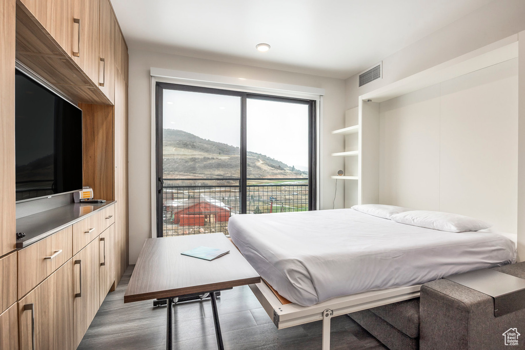 Bedroom with wood finished floors