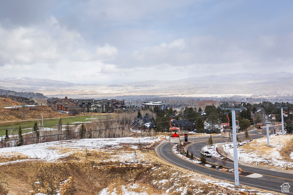 Snowy aerial view featuring a mountain view