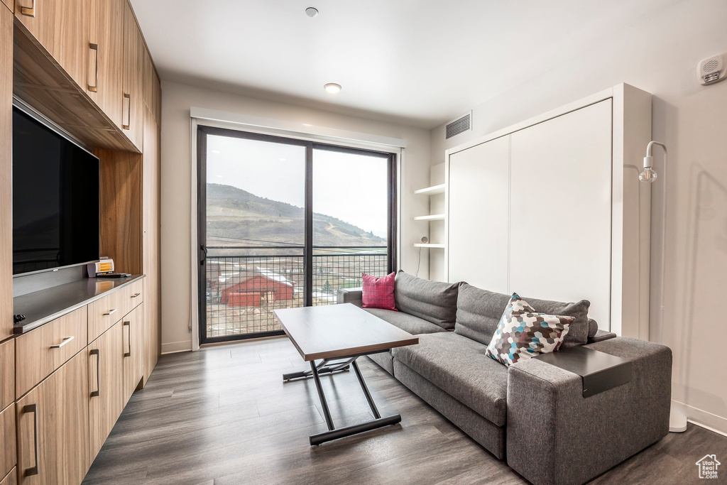 Living room with wood finished floors and baseboards
