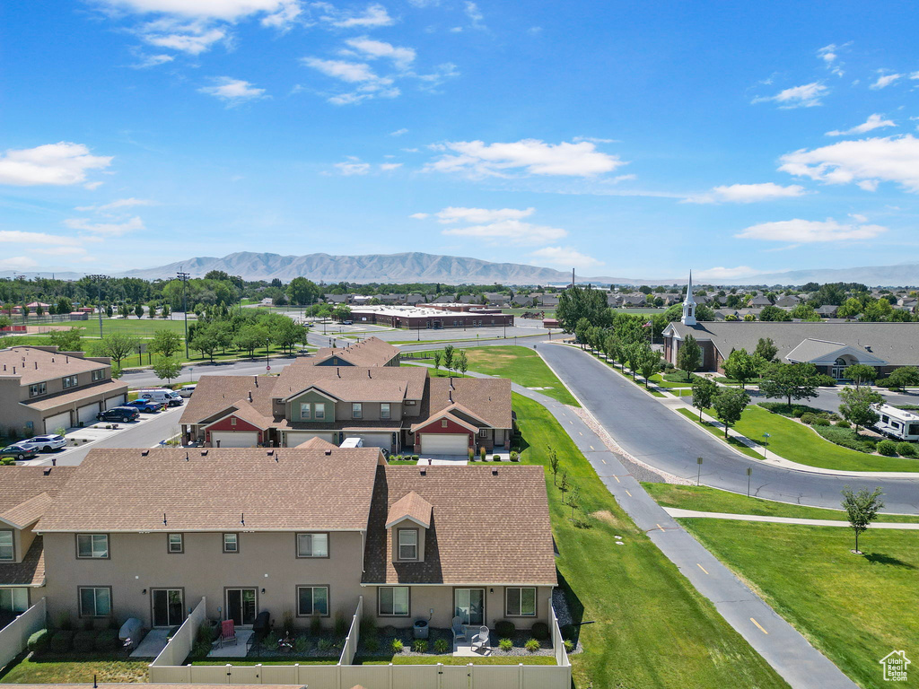 Aerial view of residential area featuring a mountain backdrop