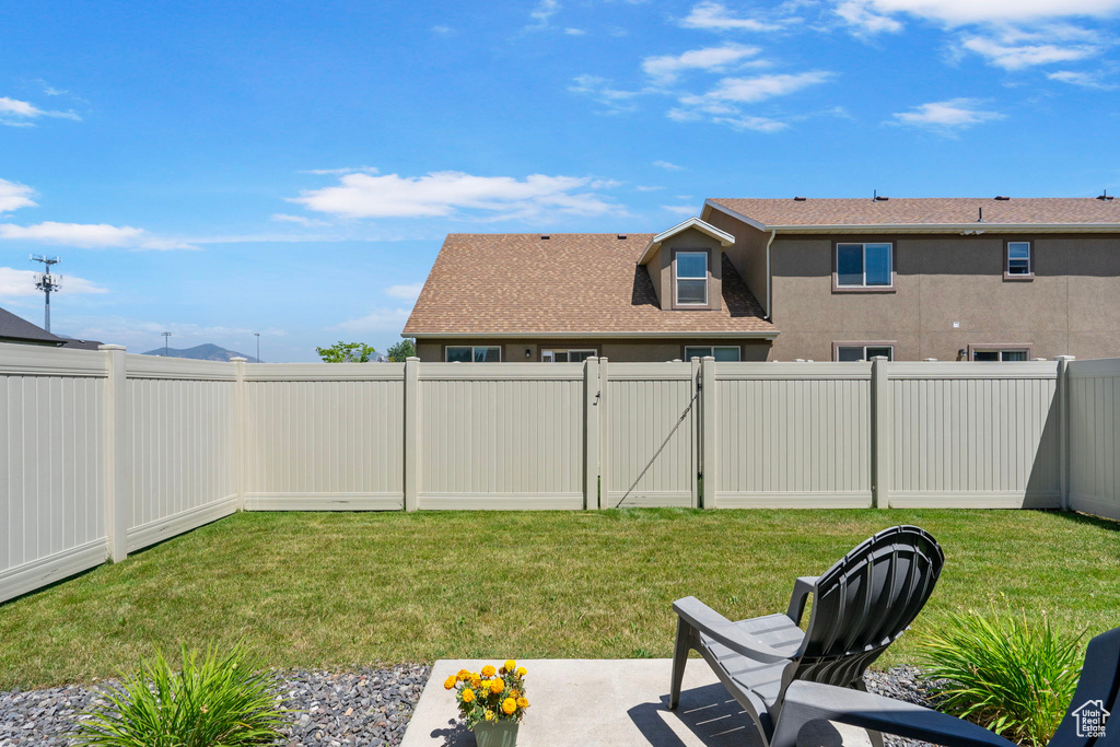 Fenced backyard with a gate