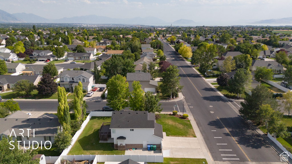 Aerial view of residential area featuring mountains
