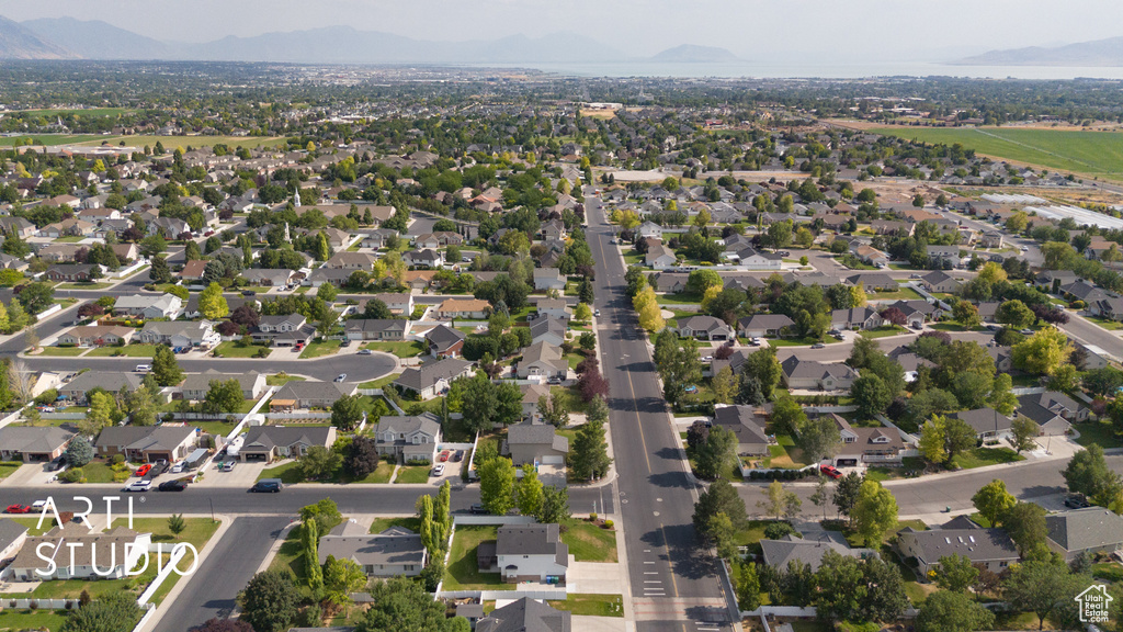 View of property location with a mountainous background and nearby suburban area