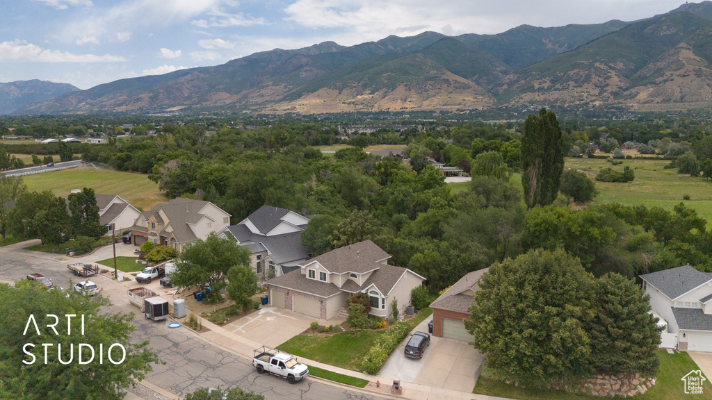 Aerial perspective of suburban area featuring a mountainous background