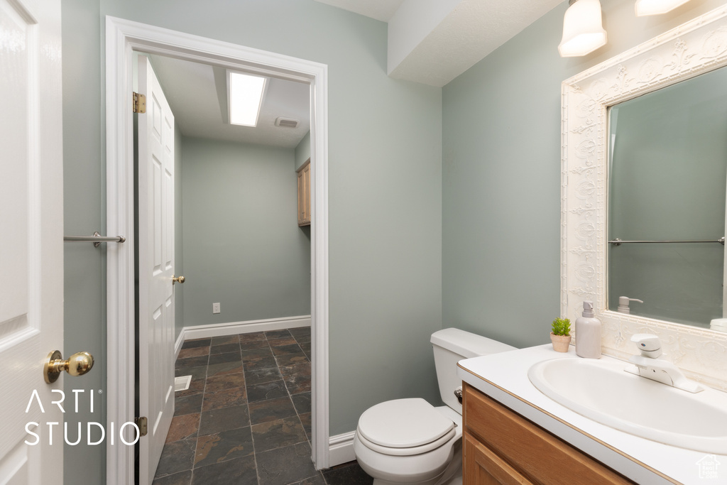 Bathroom featuring vanity and stone finish flooring