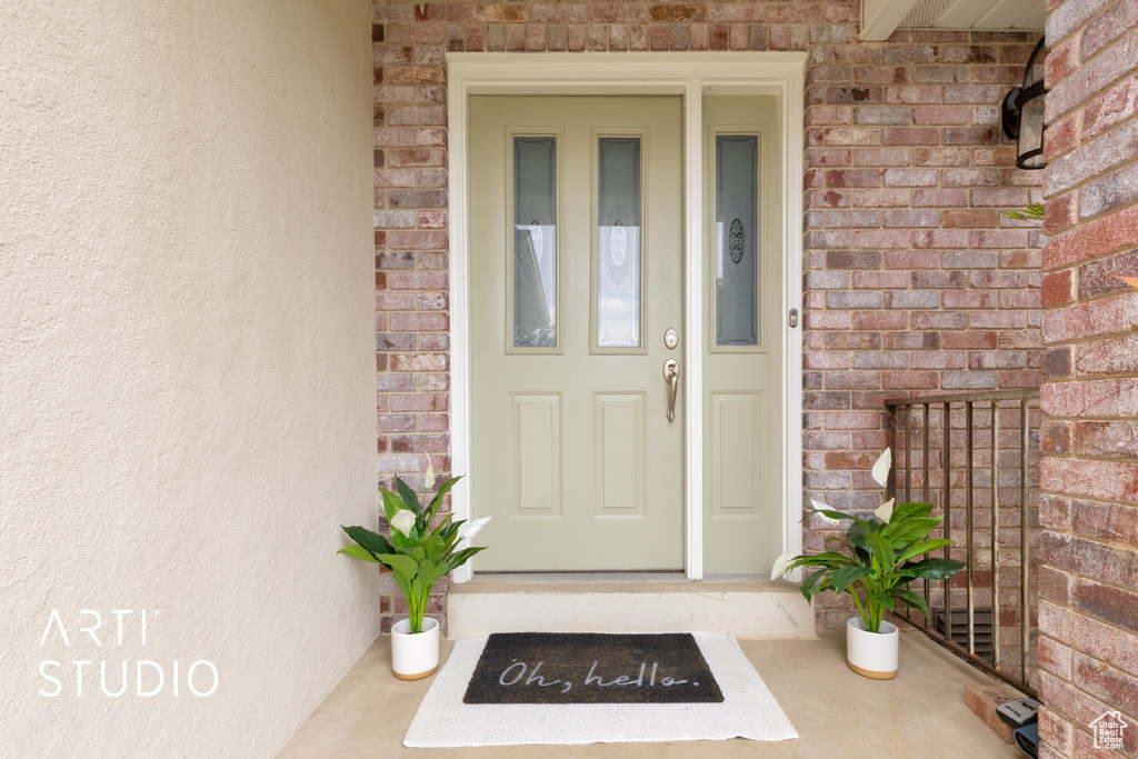 Property entrance with brick siding