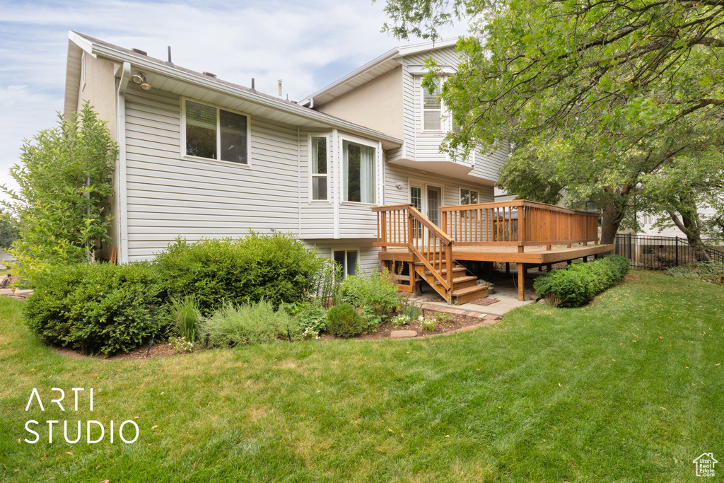 Back of property featuring a deck