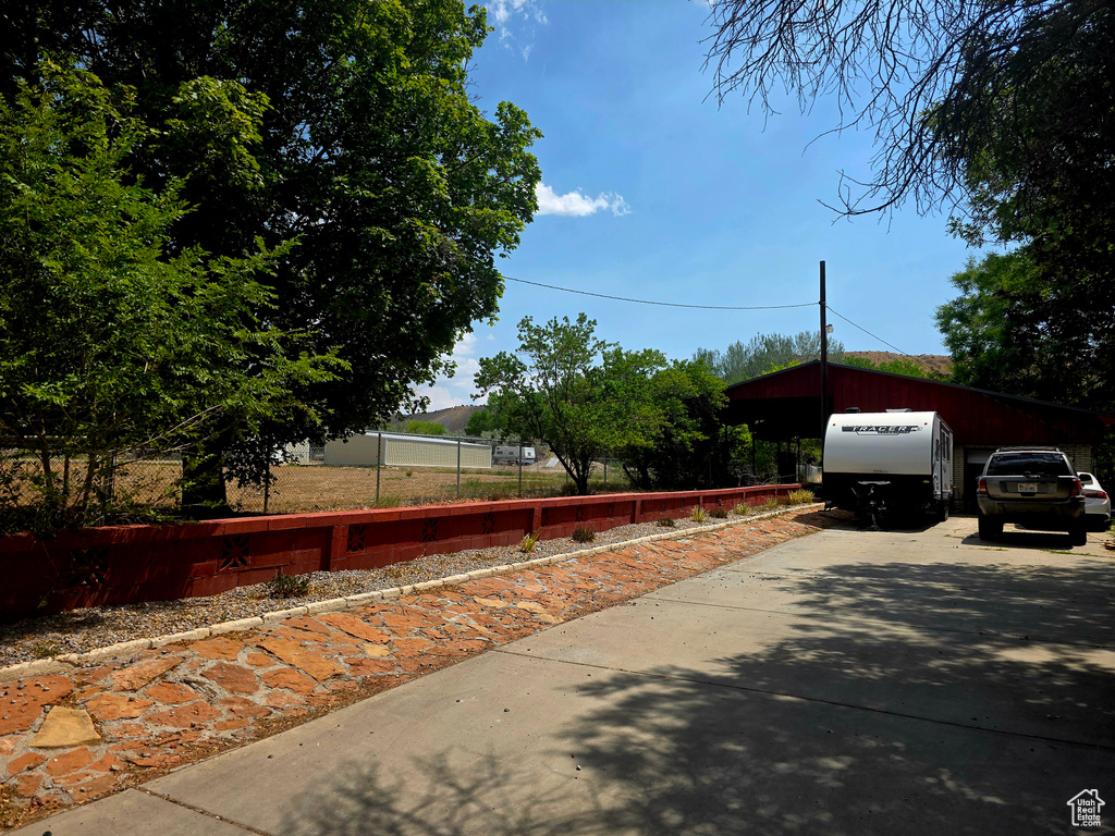 View of front of property featuring concrete driveway