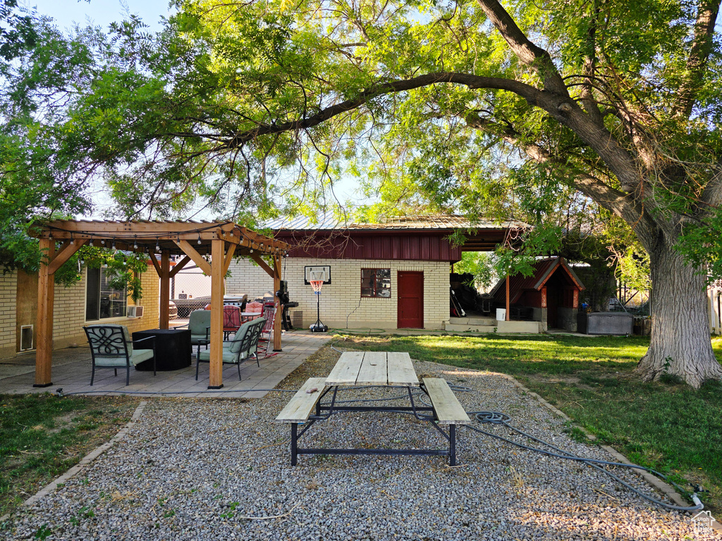 View of patio with outdoor lounge area and a pergola