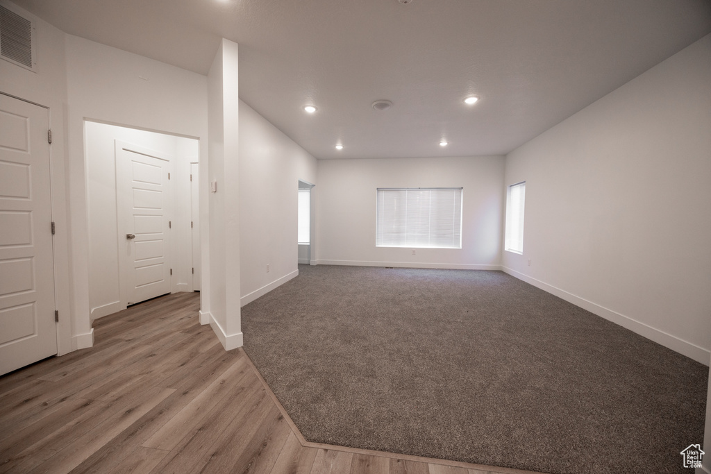 Empty room featuring recessed lighting and wood finished floors