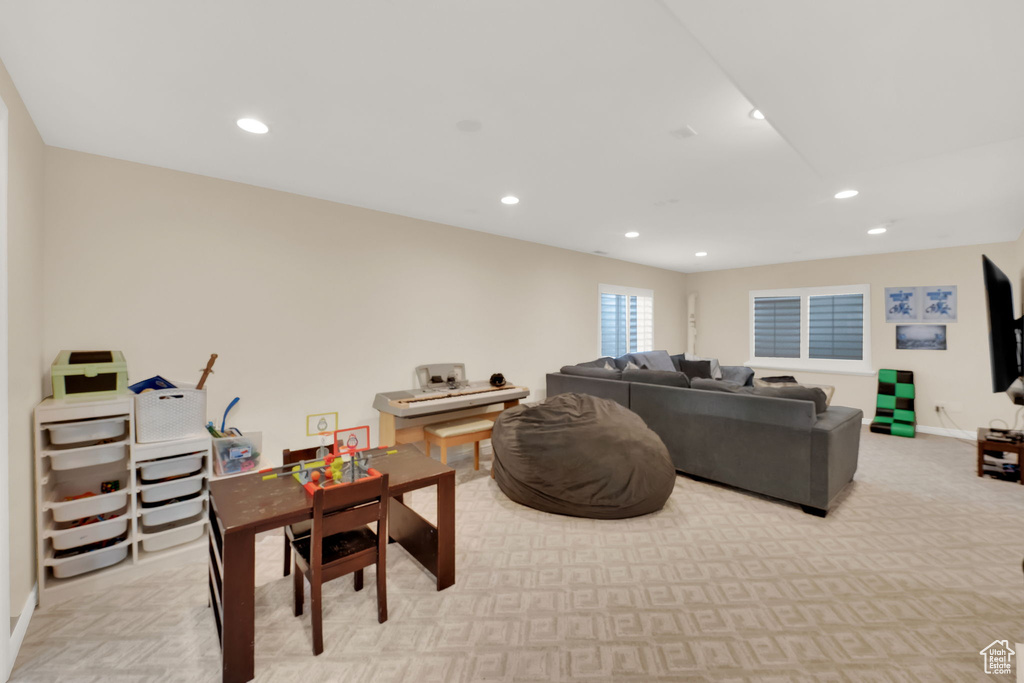 Living room with recessed lighting and light carpet