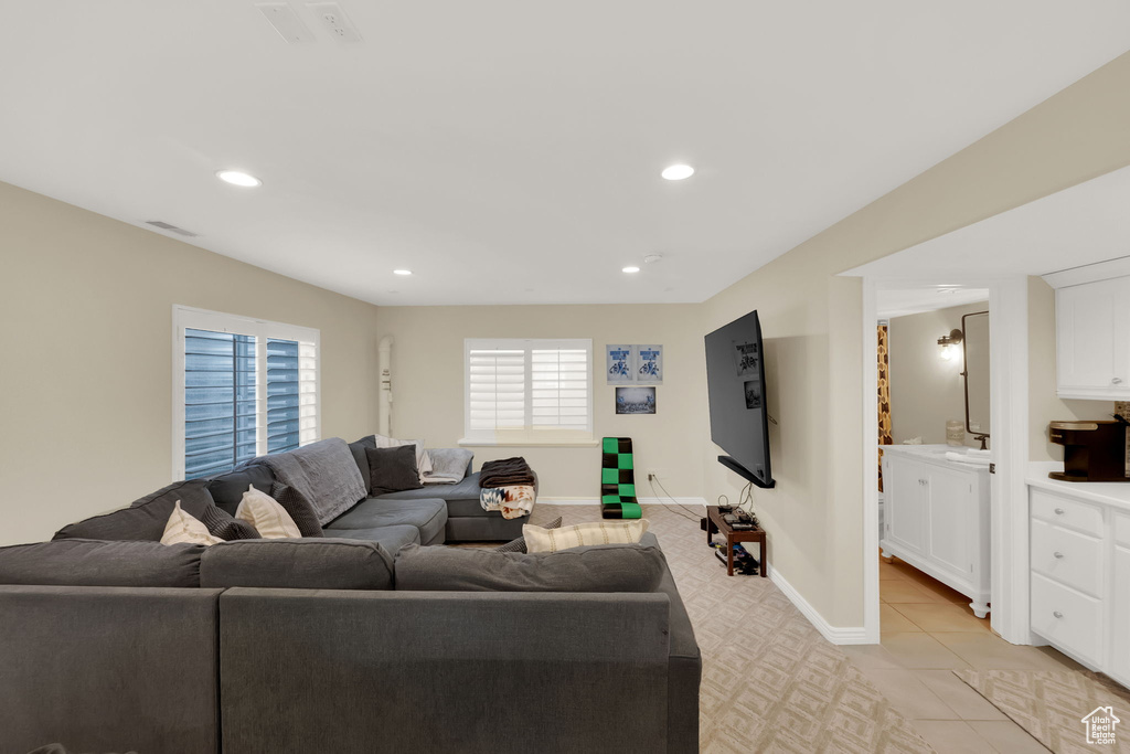 Living area featuring recessed lighting and baseboards
